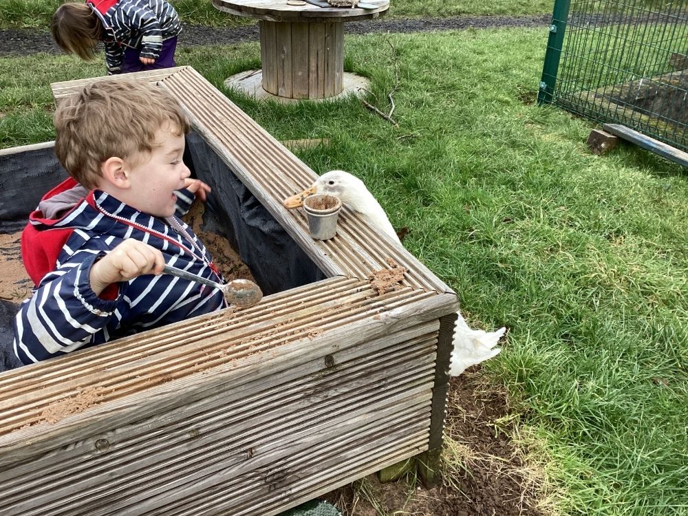 Antony School children outdoor sand pit with duck