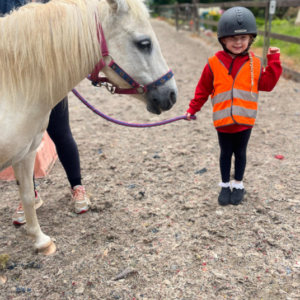 St Dominic Primary Pupil leading pony