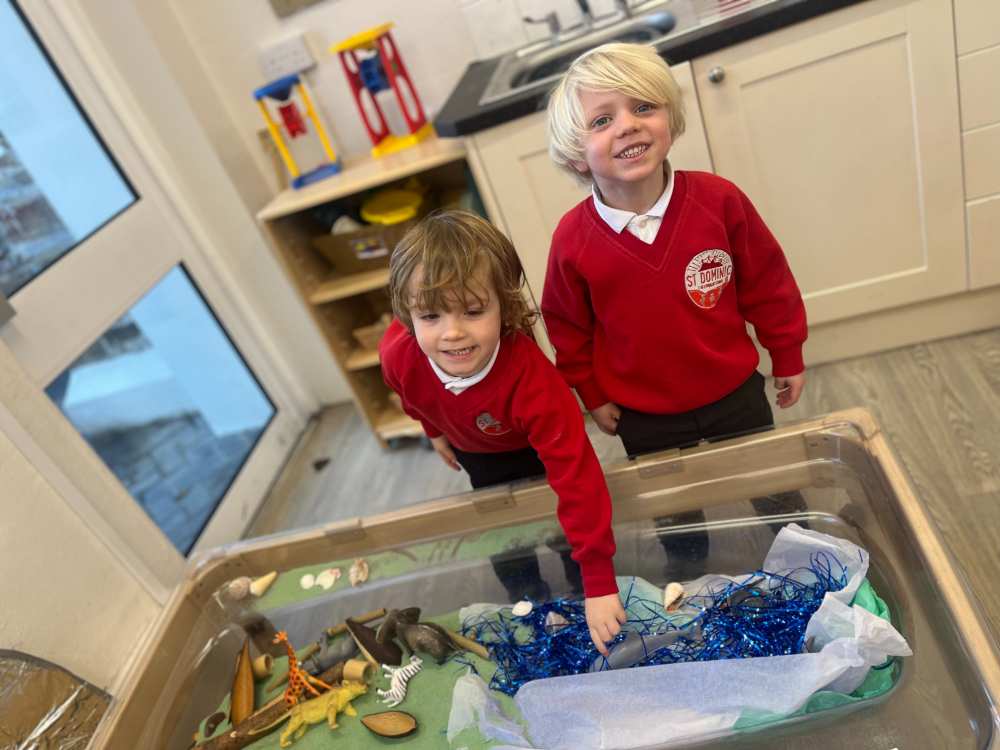 St Dominic Primary Pupils playing in messy tray