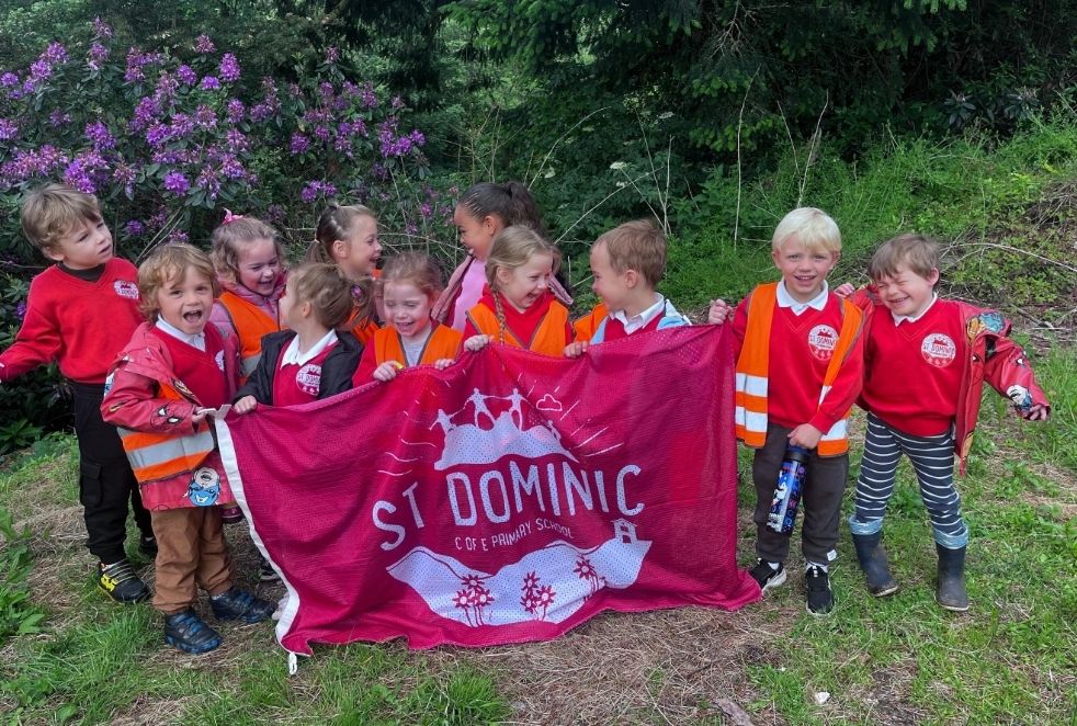 St Dominic Primary Pupils with their school flag