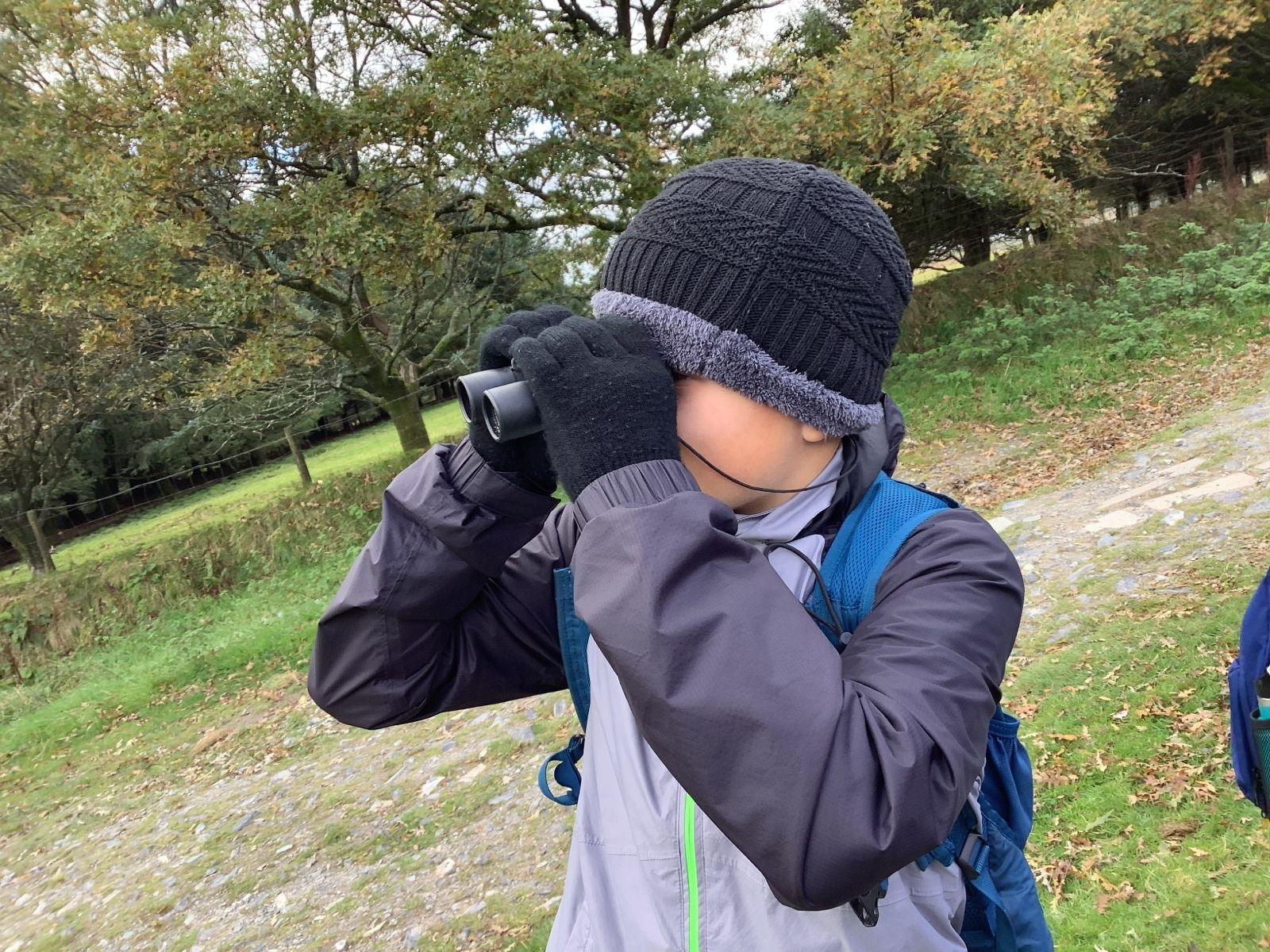 St Petrocs Primary School Pupil using binoculars